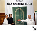 Annette and Rüdiger Nehberg presenting THE GOLDEN BOOK with Stefanie Silber who designed the book